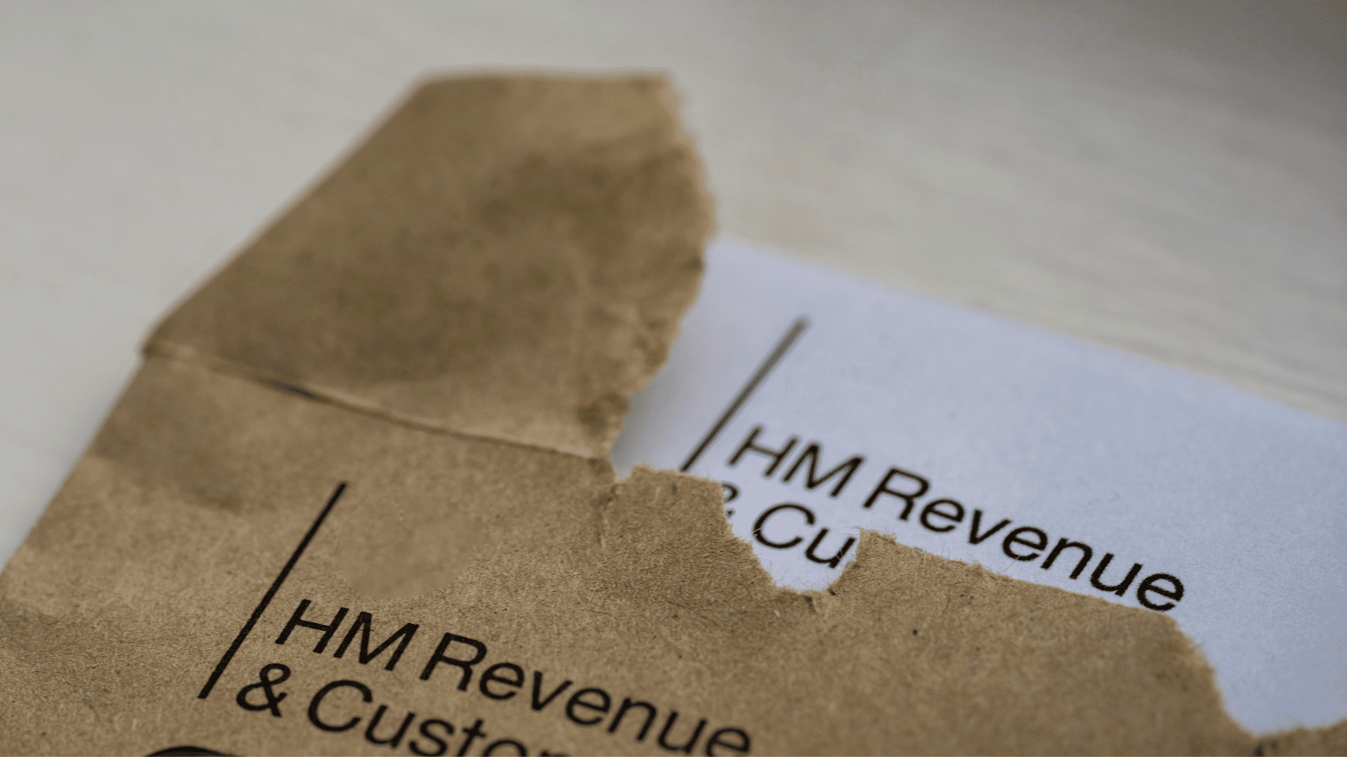 An open brown envelope with a letter from HMRC inside.